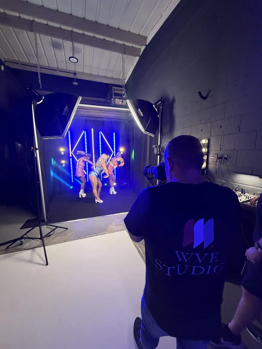 Filming a dance trio against LED lighting backdrops in the WVE studio