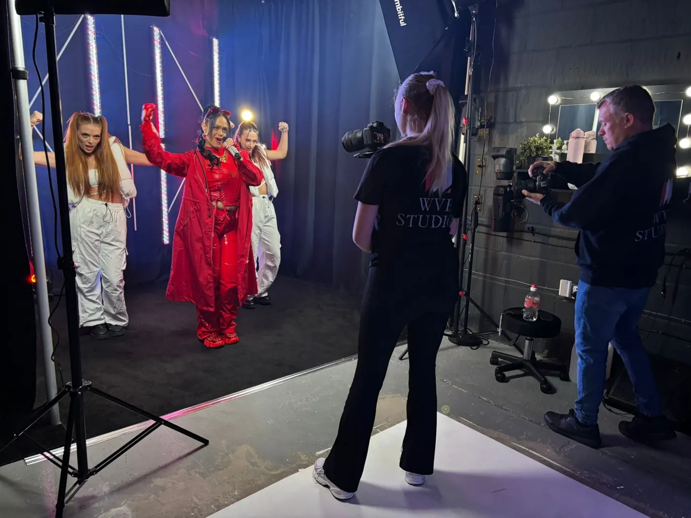 WVE Studios crew filming and photographing a live group performance in the studio